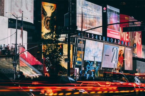 What should I consider before buying a commercial LED display?
